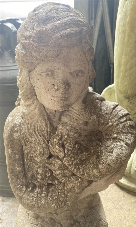 A reconstituted stone garden ornament of a kneeling girl, height 63cm